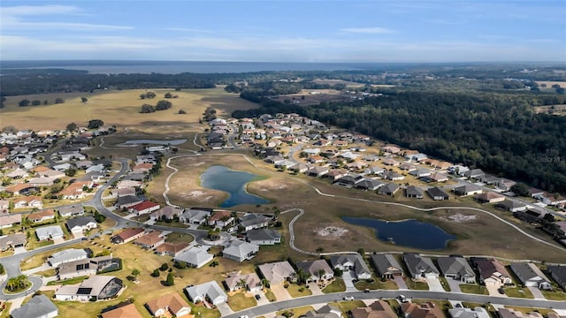 bird's eye view featuring a water view and a residential view