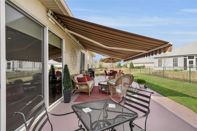 view of patio with outdoor dining space and a fenced backyard