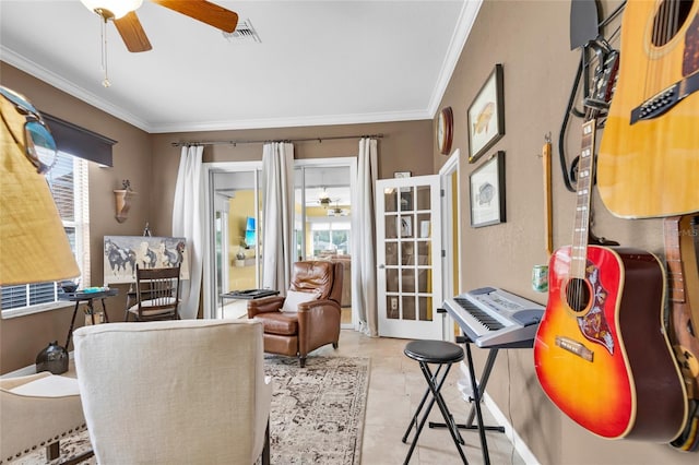 office area featuring a healthy amount of sunlight, visible vents, and ornamental molding