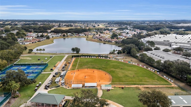 drone / aerial view featuring a water view and a residential view