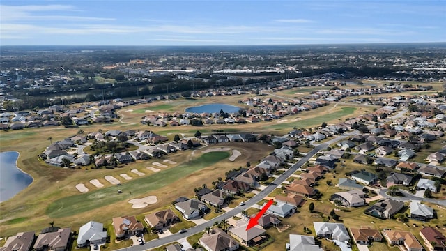 aerial view featuring a residential view, a water view, and golf course view