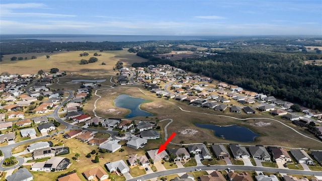 bird's eye view featuring a residential view and a water view