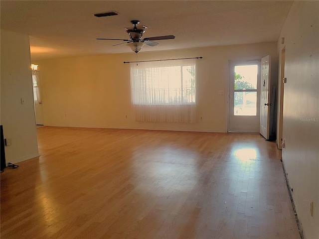 unfurnished room with ceiling fan and light hardwood / wood-style floors