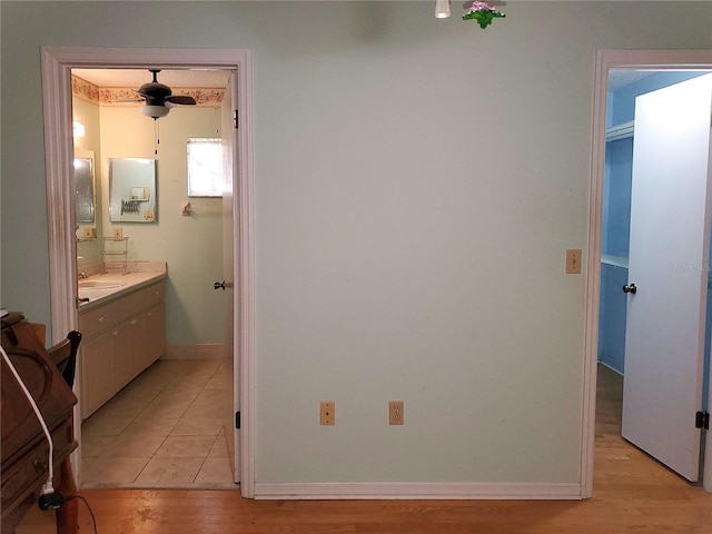 interior space with sink and light wood-type flooring