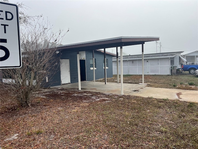 view of front of property with a carport