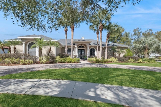 view of front of property with a front lawn