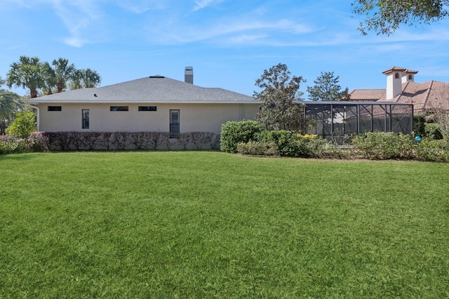 view of yard with a lanai