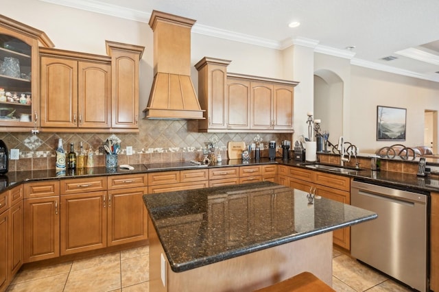 kitchen featuring a kitchen island, dishwasher, sink, dark stone countertops, and custom exhaust hood