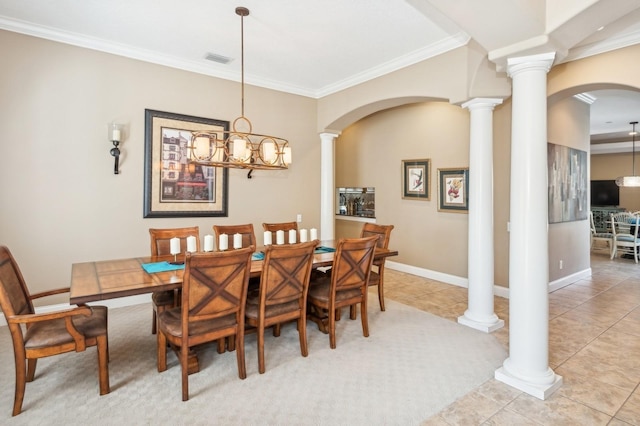 tiled dining room with ornamental molding and decorative columns