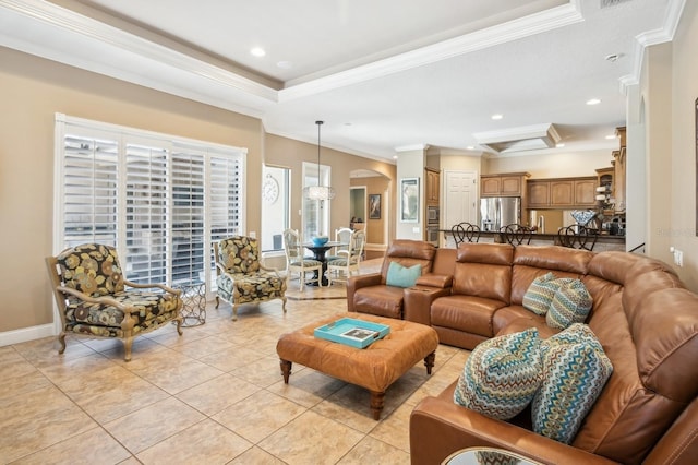 living room featuring a raised ceiling, crown molding, and light tile patterned floors