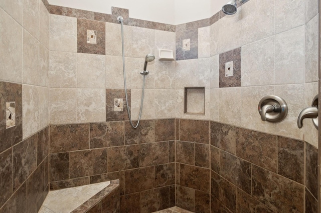 bathroom with tiled shower