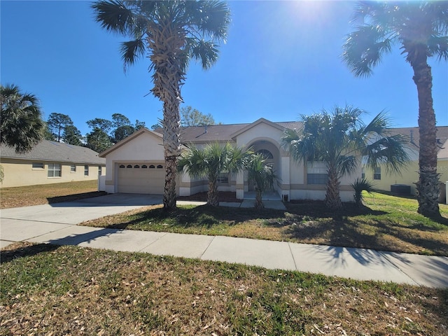 view of front of house featuring a garage and a front lawn