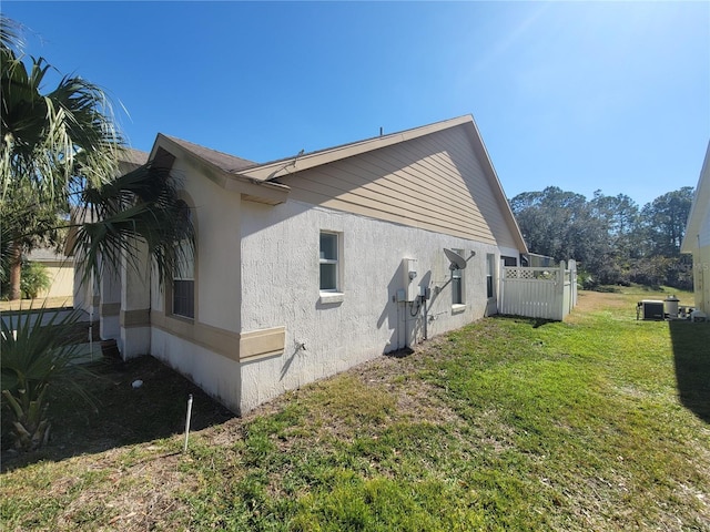 view of home's exterior featuring a lawn