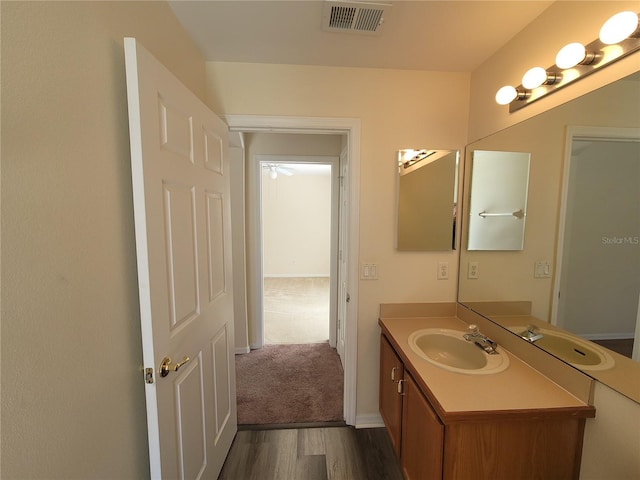 bathroom featuring vanity and hardwood / wood-style floors