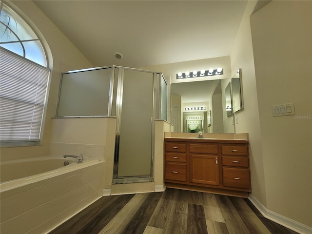 bathroom with vanity, plus walk in shower, and hardwood / wood-style floors