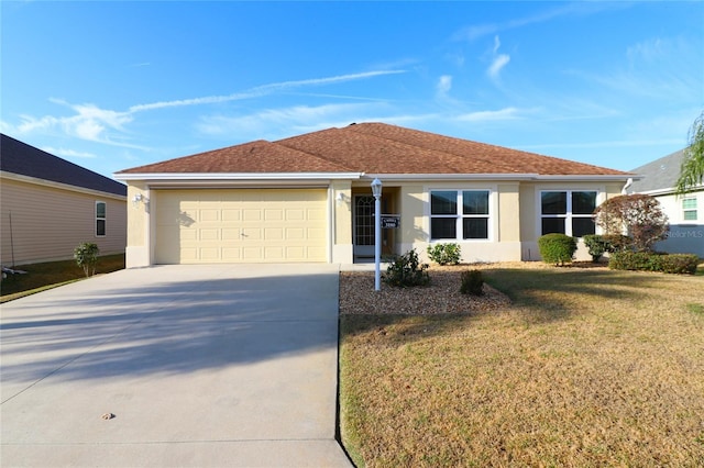 ranch-style home with a garage and a front lawn