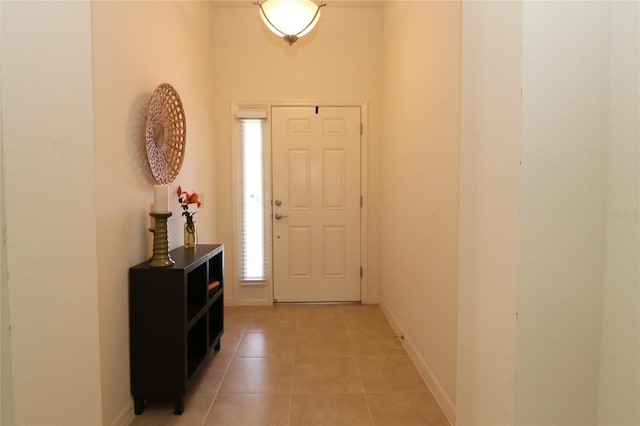 entryway with light tile patterned floors