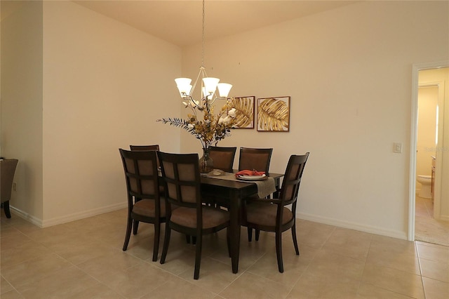 dining room featuring a notable chandelier and light tile patterned floors