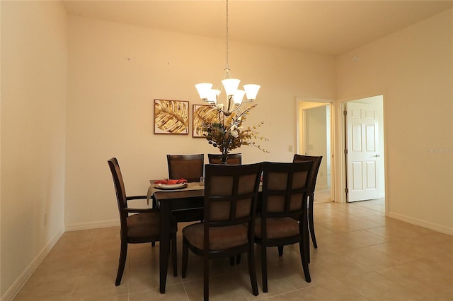 tiled dining space featuring a chandelier