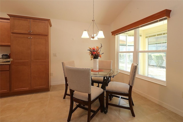 dining room with an inviting chandelier, vaulted ceiling, and light tile patterned flooring