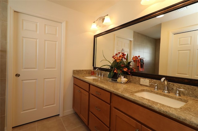 bathroom with tile patterned flooring and vanity