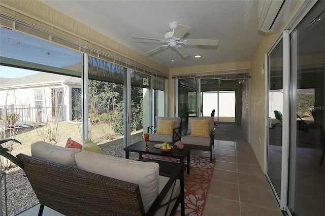 sunroom / solarium featuring a wall unit AC and ceiling fan