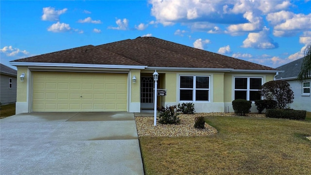 single story home featuring a garage and a front yard