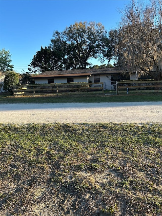 view of community with a fenced front yard