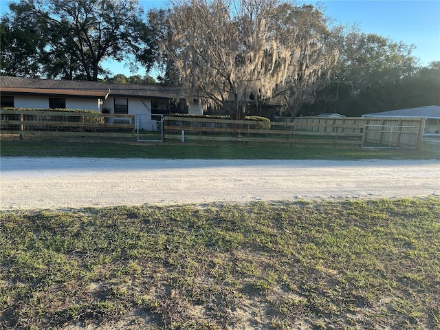 property view of water featuring fence