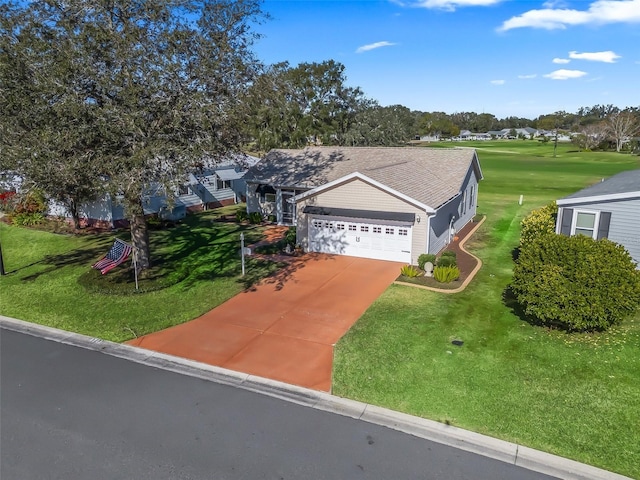 view of front of home featuring a garage and a front yard