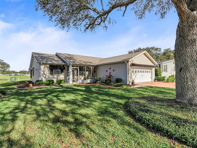 ranch-style home with a garage, a sunroom, and a front yard