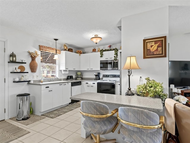 kitchen featuring white cabinetry, hanging light fixtures, a textured ceiling, dishwasher, and range with electric cooktop