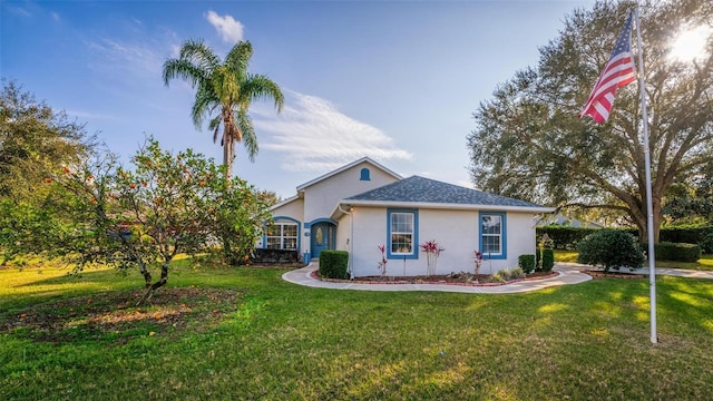 ranch-style house featuring a front yard