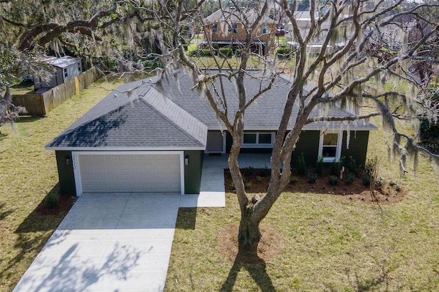 view of front of home featuring a garage and a front yard