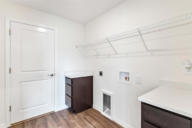 washroom featuring hookup for a washing machine, hardwood / wood-style flooring, and hookup for an electric dryer