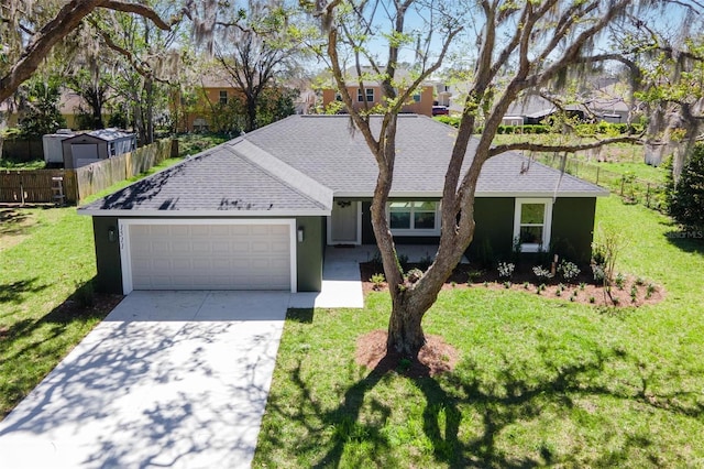 ranch-style house with a garage, a shingled roof, concrete driveway, fence, and a front lawn