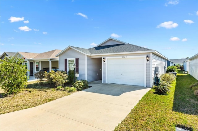 ranch-style house featuring a garage and a front yard