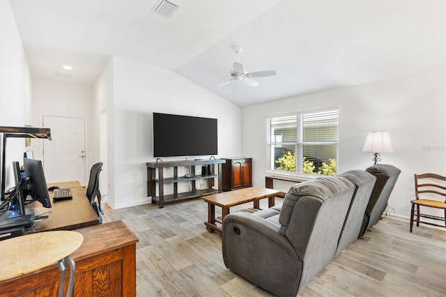 living room with ceiling fan, lofted ceiling, and light hardwood / wood-style flooring