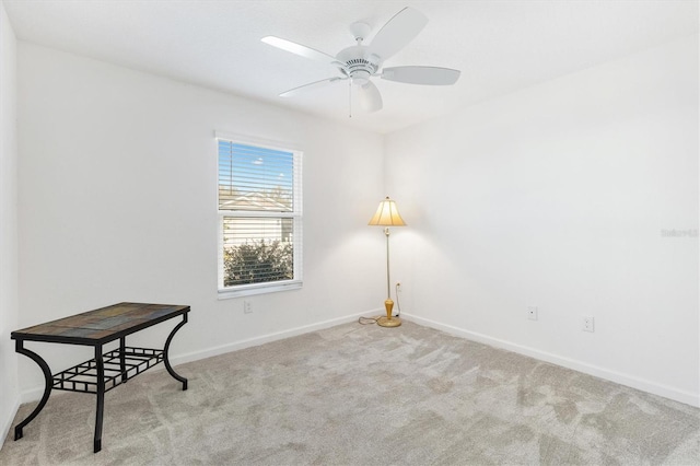 sitting room featuring light carpet and ceiling fan