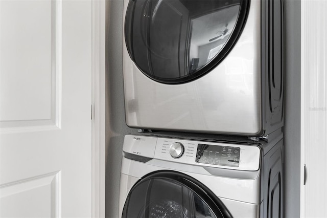 laundry room featuring stacked washing maching and dryer