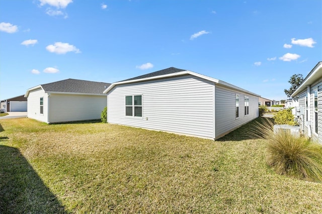 view of property exterior with a yard