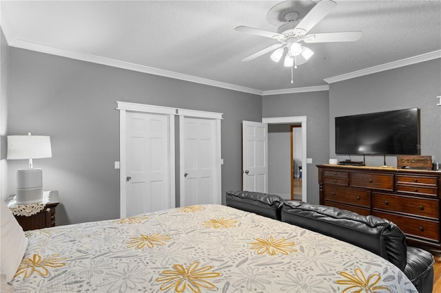 bedroom featuring a closet, a textured ceiling, ceiling fan, and crown molding