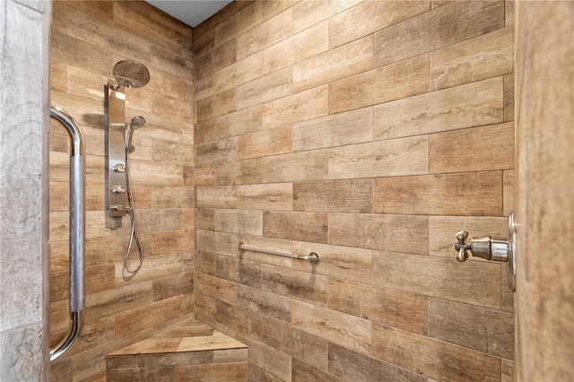 full bath featuring tiled shower