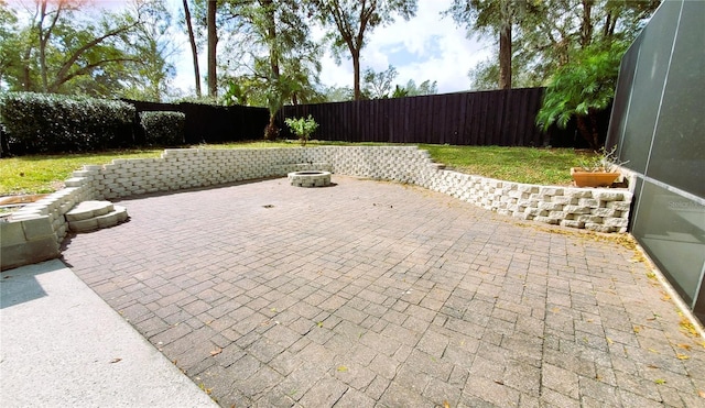 view of patio / terrace featuring a fire pit and a fenced backyard