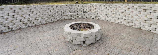 exterior details with a fire pit