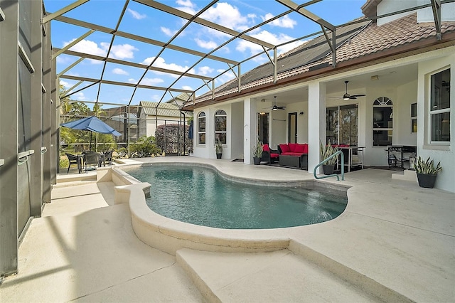 view of swimming pool featuring ceiling fan, an outdoor living space, a patio area, and glass enclosure