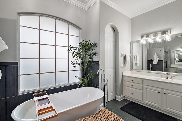 bathroom with vanity, crown molding, tile patterned floors, and separate shower and tub