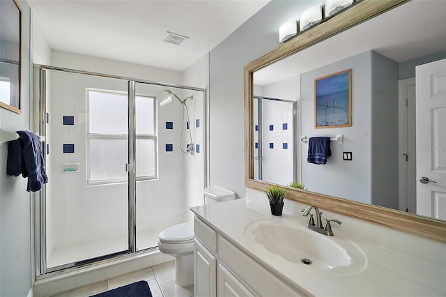 bathroom with walk in shower, tile patterned floors, vanity, and toilet