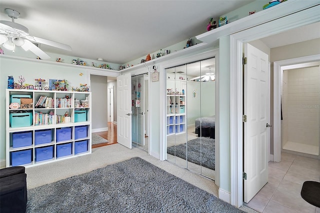 interior space with carpet and ceiling fan