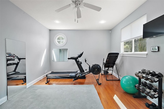 workout area with light hardwood / wood-style flooring